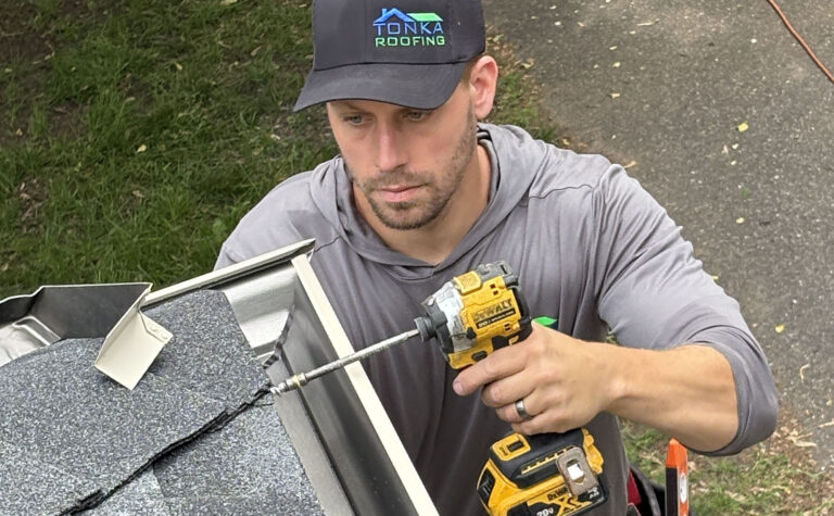 Installing gutters on a house